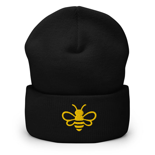 MHA Signature Beanie featuring the MHA MHA Signature Beanie featuring the embroidered Melanin & Honey bee logo in a premium lifestyle setting.