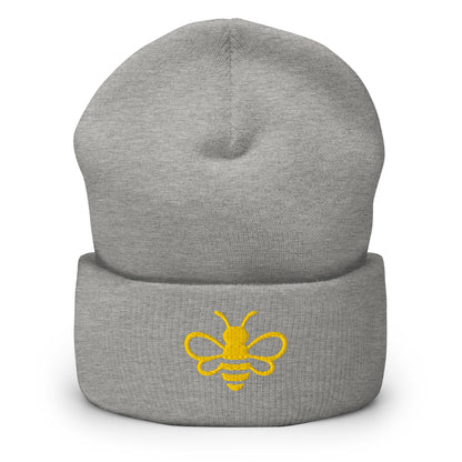 MHA Signature Beanie featuring the embroidered Melanin & Honey bee logo in a premium lifestyle setting.