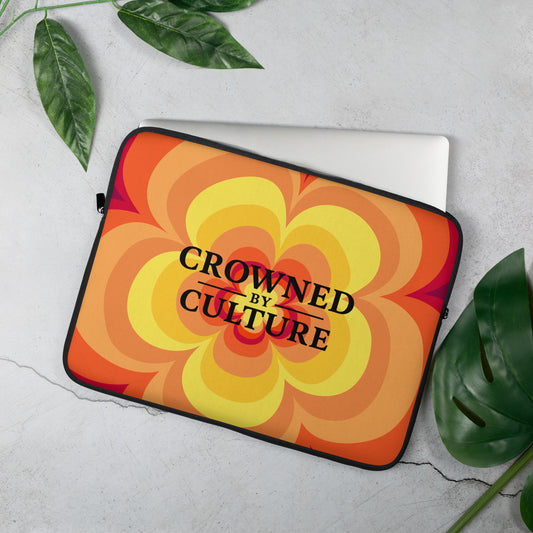 CBC laptop sleeve with vibrant cultural pattern and Crowned By Culture text on the front.