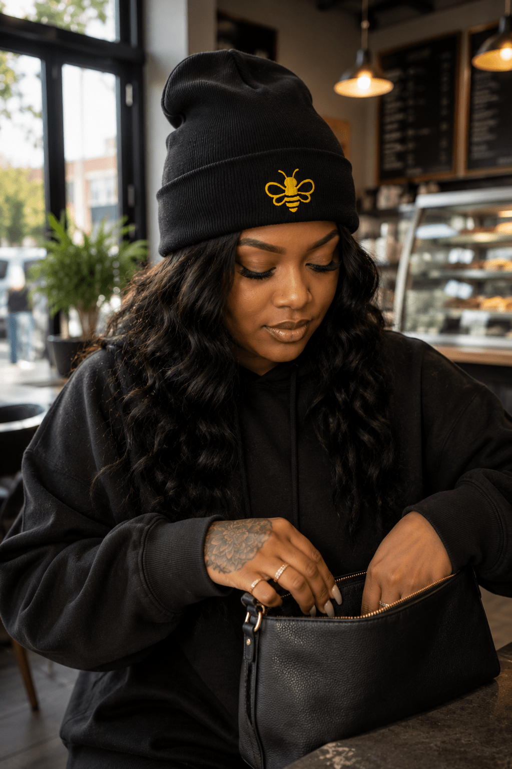 MHA Signature Beanie featuring the embroidered Melanin & Honey bee logo in a premium lifestyle setting.