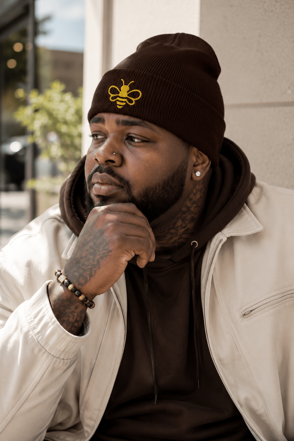 MHA Signature Beanie featuring the embroidered Melanin & Honey bee logo in a premium lifestyle setting.